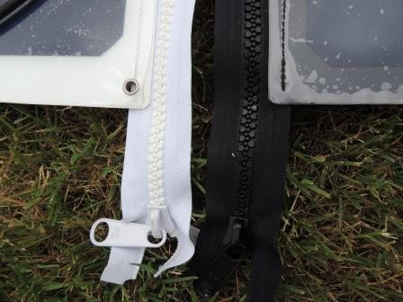 zips attached to a flexible solar panel as fixing method to boat bimini