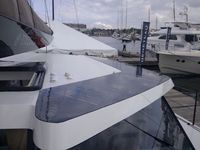 Black custom shaped flexible panels on catamaran