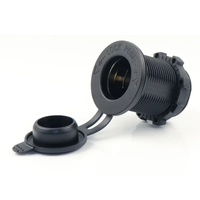 Angled view of black 12V cigarette lighter power socket with open rubber cover and threaded body
