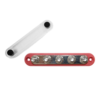 Red 5 stud busbar with removed clear protective cover and stainless steel nuts