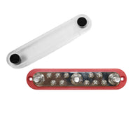 Overhead view of red busbar with three M10 studs, ten screws and detached clear cover