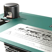 Detailed view of the M8 battery terminal post and safety instructions on the top panel