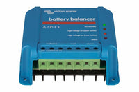 Bottom-angled view of battery balancer showing green screw terminals and cooling fins