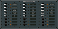 Front view of Blue Sea 24-position DC distribution panel with toggle switches and backlit labels