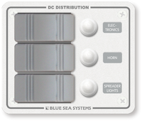 White Blue Sea 3-position marine DC distribution panel with grey rocker switches and waterproof circuit breaker boots
