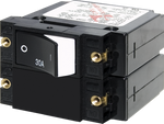 Blue Sea 30A double-pole circuit breaker with black raised rocker switch and brass mounting inserts