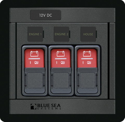 Blue Sea Panel 360 control lockout slides protecting three ML-Series switches on a marine electrical panel