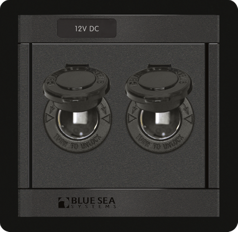 Front view of a black dual-socket 12V DC power outlet panel with protective covers open