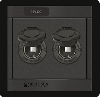 Front view of a black dual-socket 12V DC power outlet panel with protective covers open