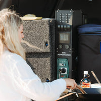 Outdoor cooking setup powered by the Enerdrive Adventurer canopy system