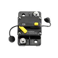 Close up of circuit breaker terminals with AUX and LOAD molded polarity markings
