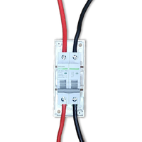 Circuit breaker wired with red and black cables mounted in an enclosure base