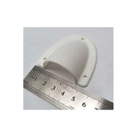 Front perspective of white clamshell cable cover with ruler showing width
