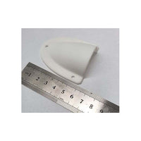 White clamshell cable entry cover positioned next to a metric ruler for scale