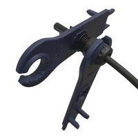 Two blue spanners interlocked on a solar connector illustrating the tightening mechanism
