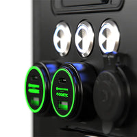 Close-up of two green illuminated 100W USB sockets and a 12V marine-grade cigarette socket