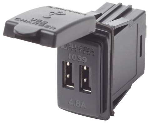 Dual USB switch-mount DC power outlet with protective dust cap open showing two USB ports