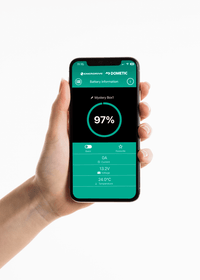 Hand holding a smartphone with the battery monitoring app showing 97 percent charge status