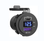 Angled view of black socket showing USB-C PD port, blue digital voltmeter, power button and QC 3.0 USB-A port