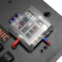 Close-up of 6-way fuse block with clear cover and wiring terminals