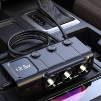 3-way lighter adaptor placed on a car centre console tray plugged into power