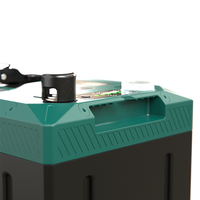 Detailed view of the integrated carry handle and LED state of charge indicator on the battery top