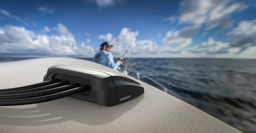 Scanstrut multi cable seal installed on a boat deck with fisherman in the background