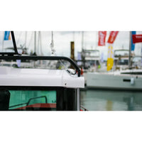 Grey Scanstrut cable seal mounted on the white roof of a boat