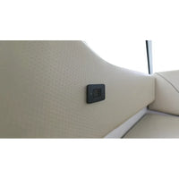 USB-C socket installed on a cream textured marine interior wall panel