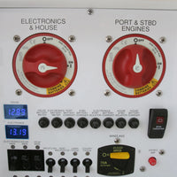 Comprehensive marine electrical panel featuring battery switches, voltmeters, and circuit breakers