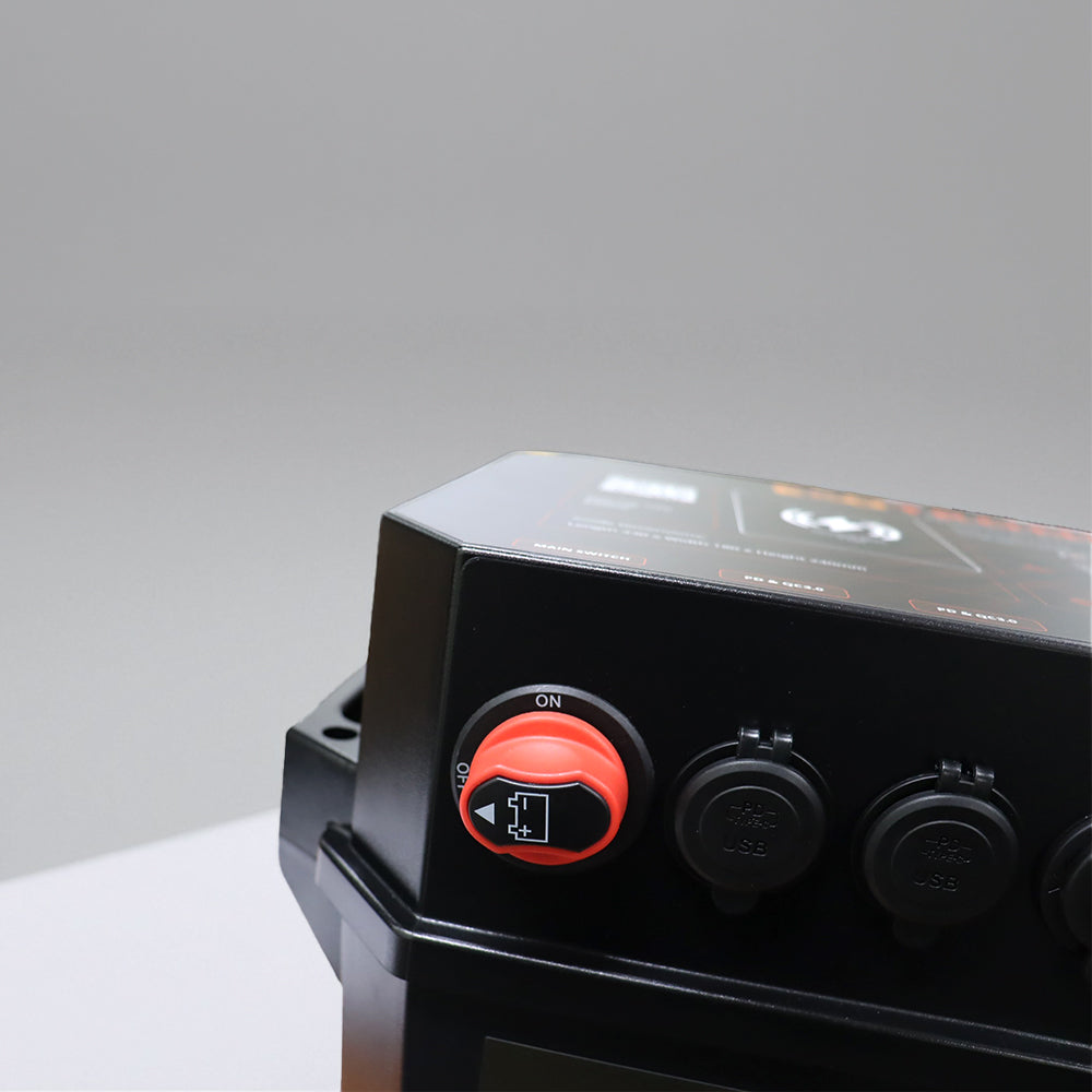 Detail view of red master switch, dual USB QC3.0 ports and digital voltmeter display