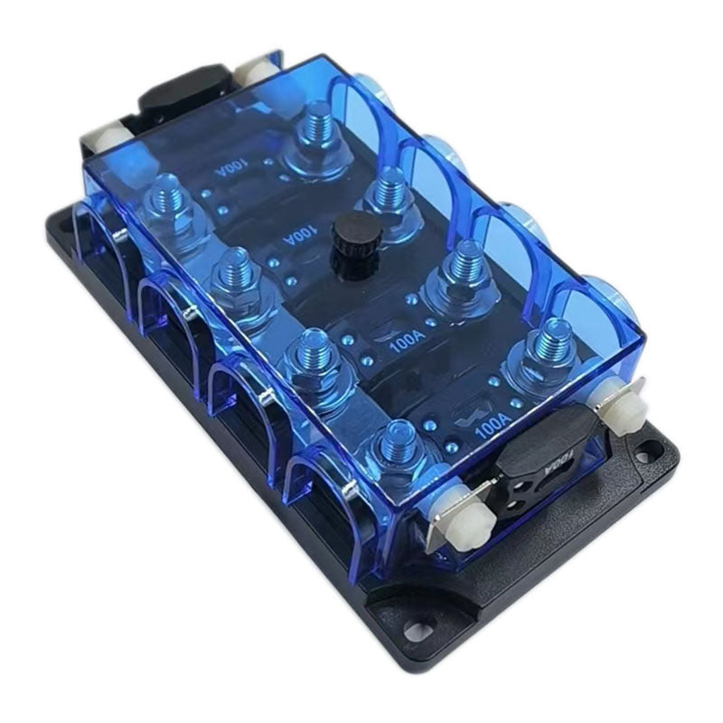 Angled top view of Exotronic fuse holder showing installed 100A mega fuses through blue cover