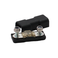 Inline MIDI fuse holder with transparent fuse fitted and black cover positioned behind