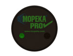 Top-down view of black circular Mopeka Pro Check sensor showing green sync button and branding