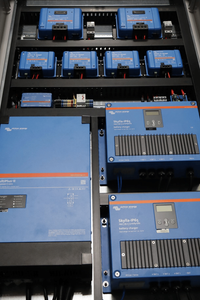 Angled close-up of MultiPlus-II inverter and Skylla-IP65 chargers with wiring