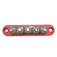 Top-down view of red busbar showing five tin-plated copper studs