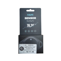 RuuviTag Pro 4-in-1 sensor in black retail packaging with mandatory button battery safety sticker