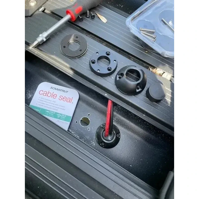 Component assembly of the Scanstrut cable seal during installation on a vehicle roof