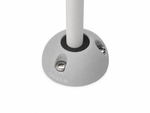 Grey vertical cable seal installed with white cable on a flat surface