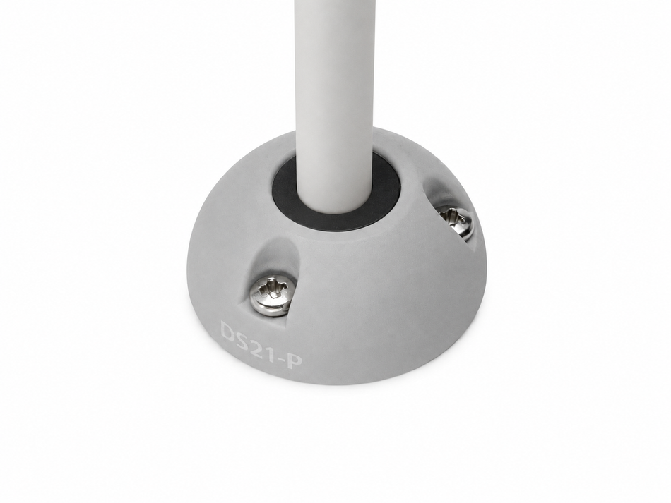 Grey vertical cable seal installed with white cable on a flat surface