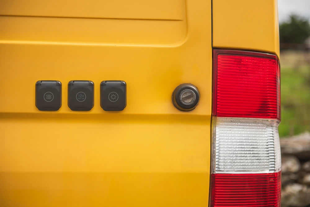 Three Scanstrut Ventura sockets mounted on the exterior of a yellow camper van