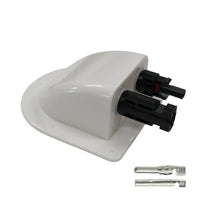 Angled view of white solar cable entry cover with integrated black connectors and loose crimp terminals