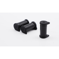 Three black solar connector caps arranged to show side profiles and the closed top with PK marking
