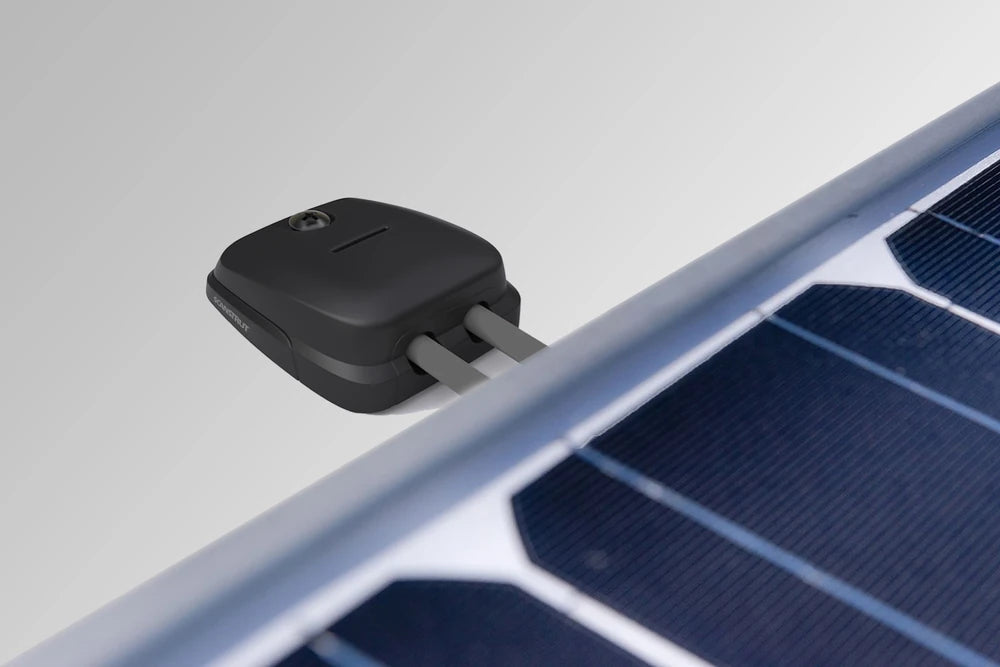 Double cable seal routing grey solar cables through a white vehicle roof