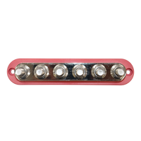 Top-down view of red busbar featuring six stainless steel studs on a nickel-plated plate