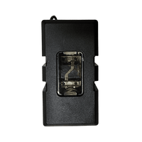 Top-down view of closed fuse holder looking through clear window at installed fuse