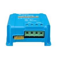 Perspective view of blue Victron converter with green terminal block and yellow blade fuse
