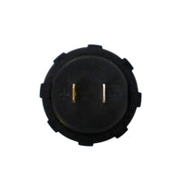 Rear of circular gauge showing positive and negative polarity markings and spade terminals