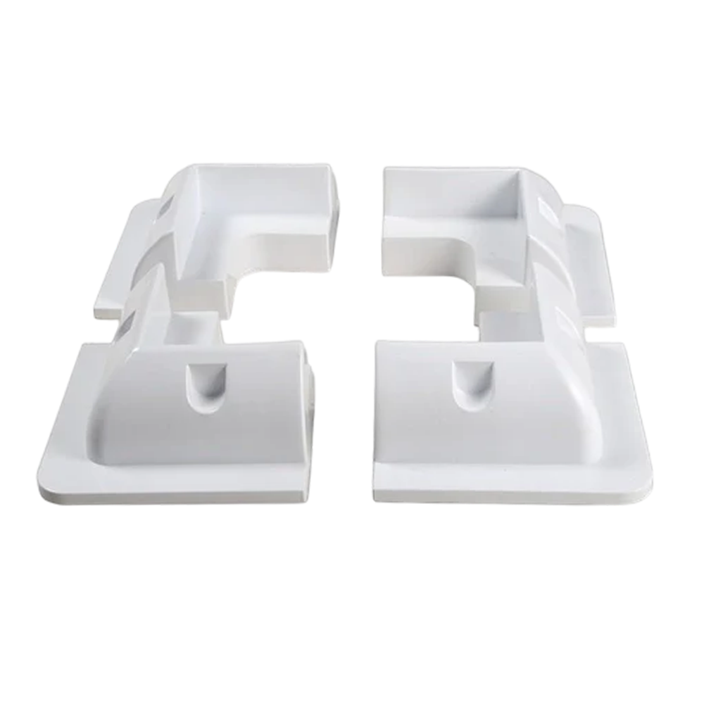 Set of four white ABS plastic corner brackets for solar panel mounting arranged in a square