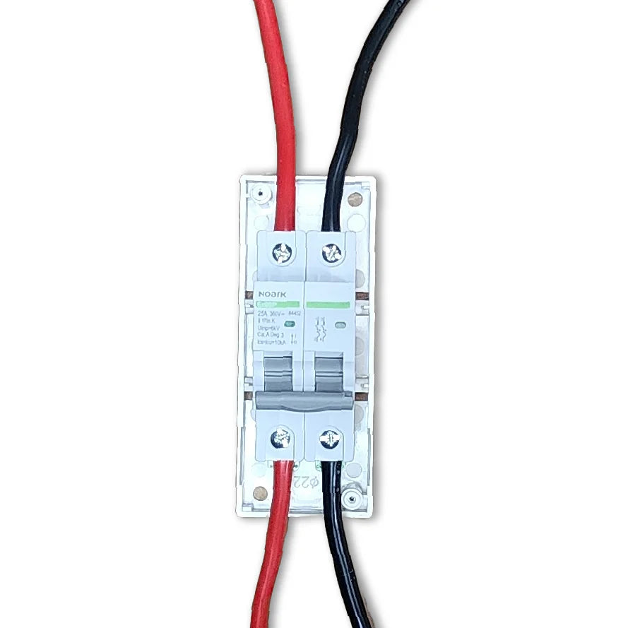 Top-down view of circuit breaker wired with red and black cables